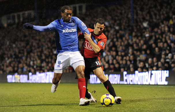 Pompey v United: Frederic Piquionne brings down Giggs