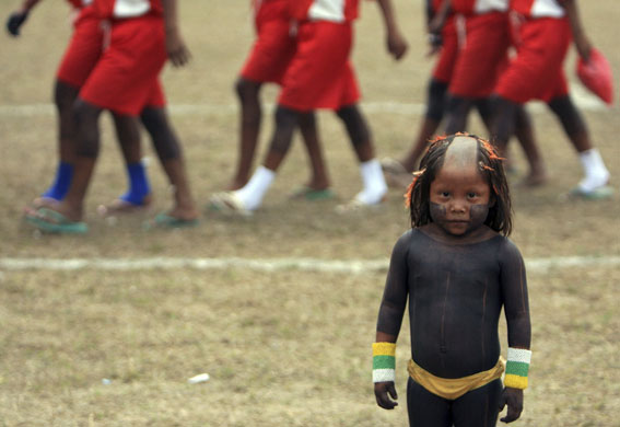 24 hours: A Xikrin child at the Indigenous Nations' Games in Pagagominas, Brazil