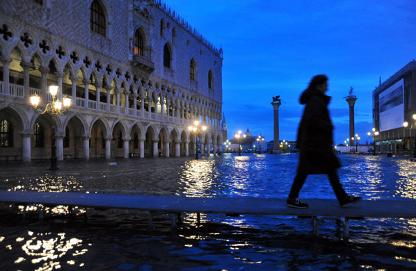 30 November 2009: Venice, Italy: The Doge's Palace on the flooded Piazza San Marco