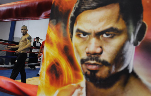 24sport: A picture of Manny Pacquiao is on display as opponent Miguel Cotto trains 