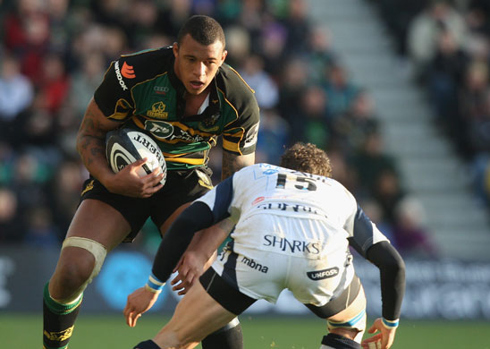 England Rugby Team: Courtney Lawes of Northampton is tackled Mick Macleod of Sale