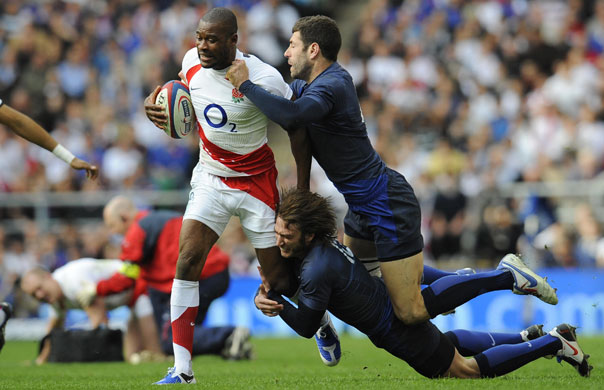 England Rugby Team: England's Ugo Monye goes past France's Maxime Medard & Julien Malzieu