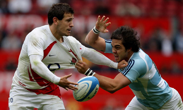 England Rugby Team: England's Danny Care is tackled by Argentina's Alejandro Abadie 
