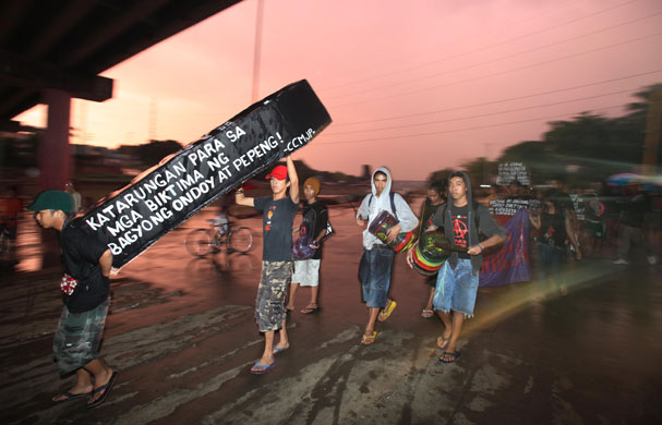 24 hours: Protesters and typhoon victims prepare to float a makeshift coffin