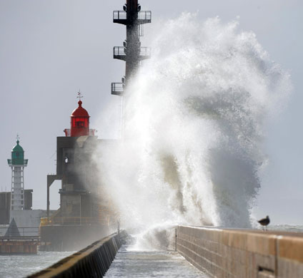 24 hours: Le Havre, France: Waves lash the sea-front promenade 