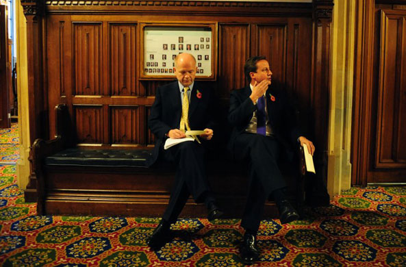 Andrew Parsons Propaganda: Cameron and Hague wait outside wait in the House of Commons