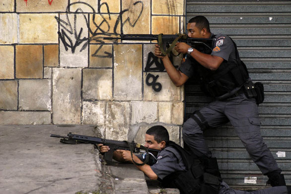 Slums in Rio De Janeiro: Police make an incursion into the Vila Cruzeiro slum in Rio de Janeiro
