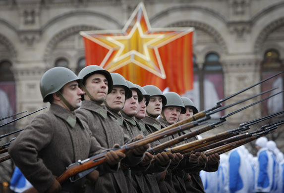 24 Hours in Pics: Soldiers dressed in Red Army World War II uniform march at Red Square 