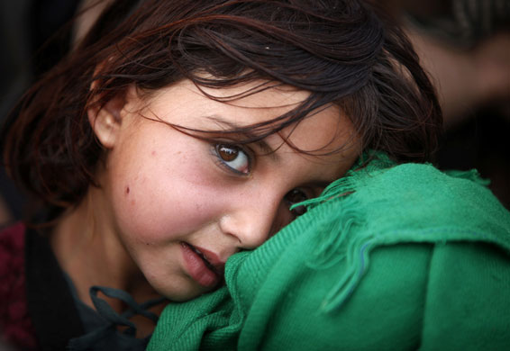 24 Hours in Pics: A girl flees a military offensive in South Waziristan