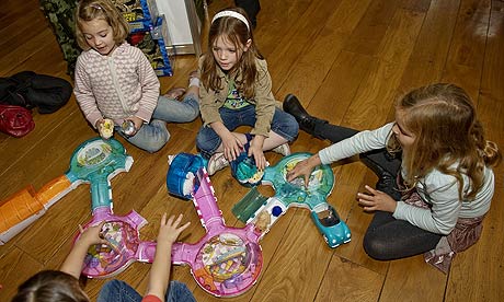 Children play with Go Go Pets hamsters