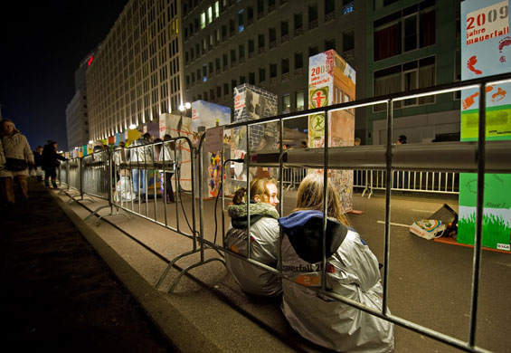 Berlin Wall celebrations: School students sit near their individually painted dominos in Berlin