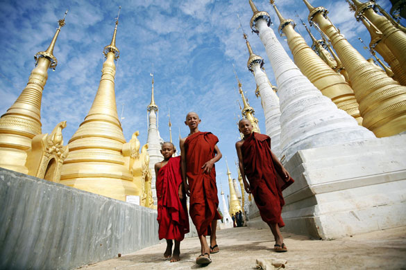 Eyewitness: Buddhist monks walk through Shwe Indein Pagoda near Inle lake