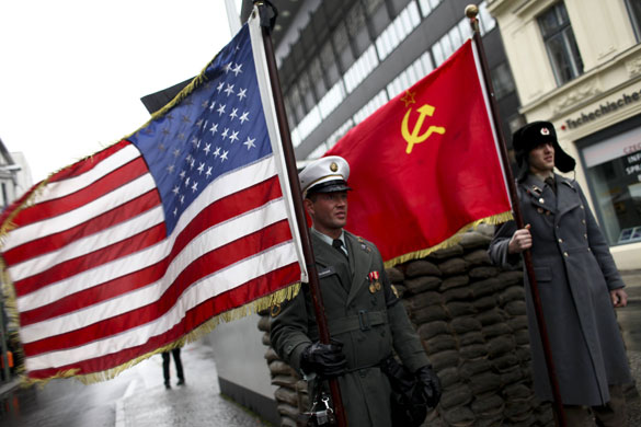 Berlin celebrations: Men dressed as US and Soviet soldiers at Checkpoint Charlie