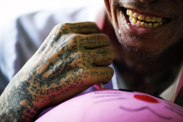 24 hours in pictures: A terminally ill Thai man rests at a hospice for AIDS sufferers