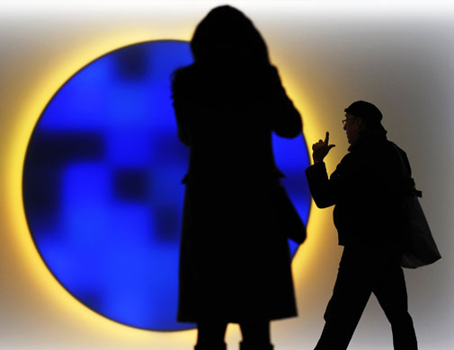 Copenhagen Diary: COP15 A delegate walks past a light installation the Bella Center