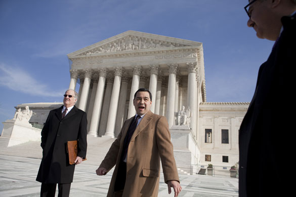 Week in Business: Miguel Estrada, lawyer for Conrad Black, centre, outside the Supreme Court
