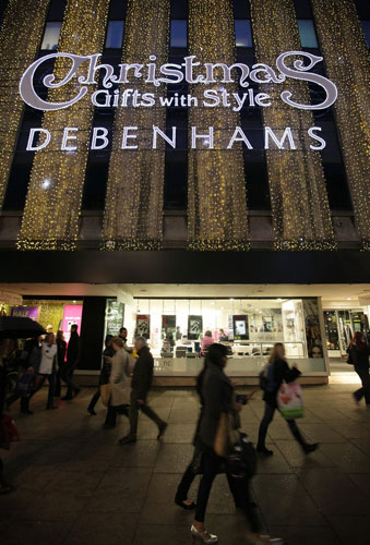 Week in Business: Christmas shoppers walk past Debenhams in Oxford Street