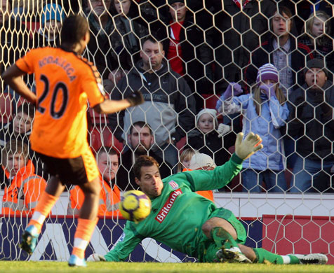 Sat round up: Stoke City's Thomas Sorensen saves a penalty by Wigan's Hugo Rodallega