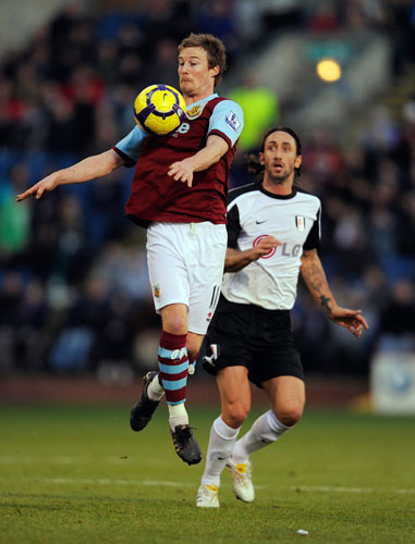 Sat round up: Burnley's Wade Elliott controls the ball ahead of Jonathan Greening