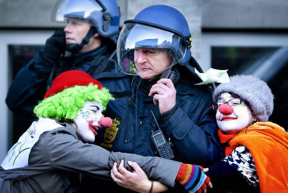 Copenhagen climate summit: Two activists hugs a policeman