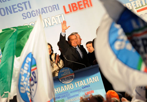 Berlusconi bleeds : Berlusconi bleeds after being punched in Milan 