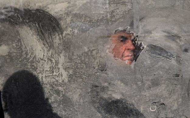 24 hours: Kiev, Ukraine: The man looks through an icy window on a bus 