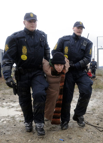 COP15 Reclaim Power: An activist is arreststed by police during a protest in Copenhagen