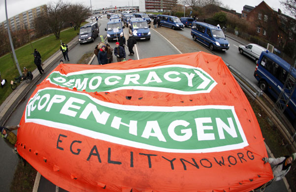 COP15 Reclaim Power: Protestors carry a banner towards Bella Center in Copenhagen