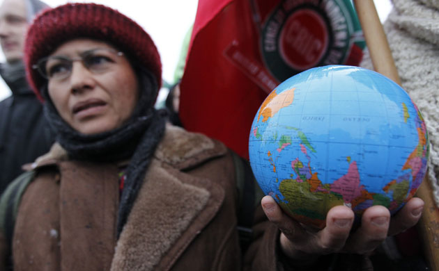 COP15 Reclaim Power: A protestor holds a globe during a demonstration in Copenhagen