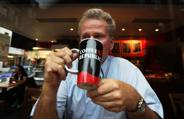 Year in Business: A man drinks a mug of coffee in Coffee Republic in Soho