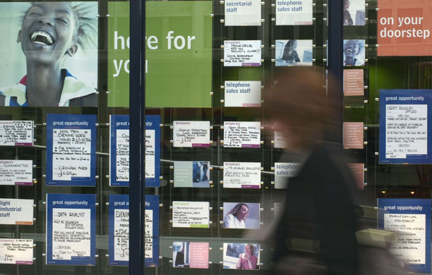 Year in Business: A woman walks by a recruitment agency in Croydon