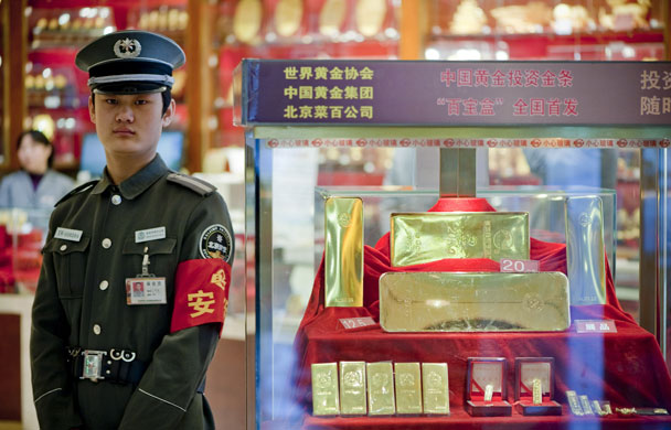 Year in Business: Large gold bars on display in cabinets at the Caibai gold store in Bejing