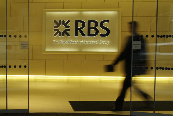 Year in Business: A man walks out of the main London branch of the Royal Bank of Scotland