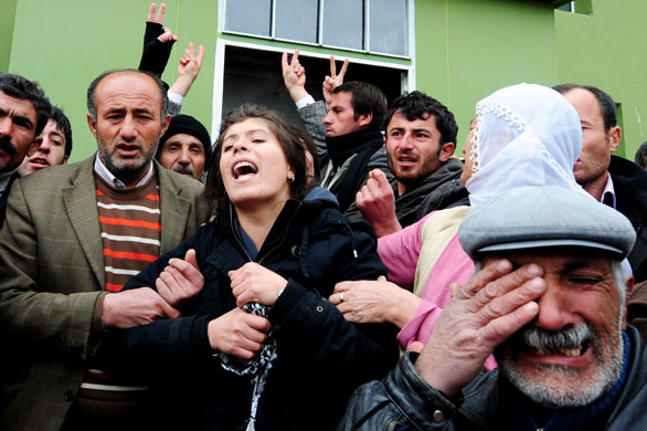 24 hours in pictures: Bulanik, Turkey: Relatives of Necmi Oral during his funeral ceremony