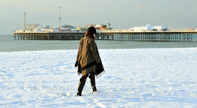 Snow in the UK: Nancy Stillwell from Essex, walks along the snow covered beach in Brighton