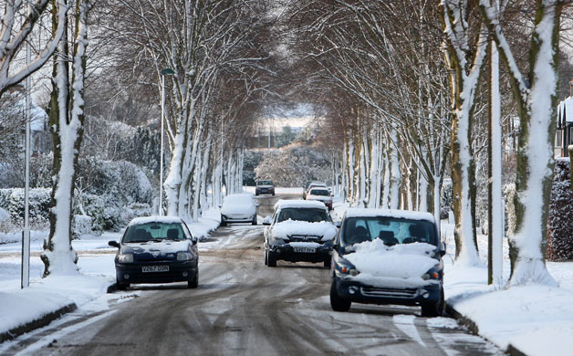 Snow in the UK: Cars are covered with snow in Carshalton Beeches
