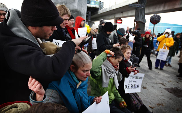 Copenhagen diary: COp15 German climate activist cuts their hair in a protest