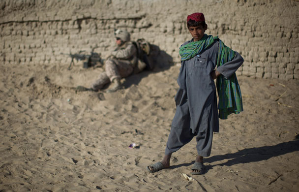 24 hours: Afghan boy poses in Helmand Province