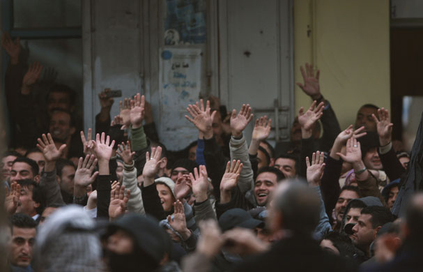 24 hours: Fatah supporters wave to the convoy of President Mahmoud Abbas