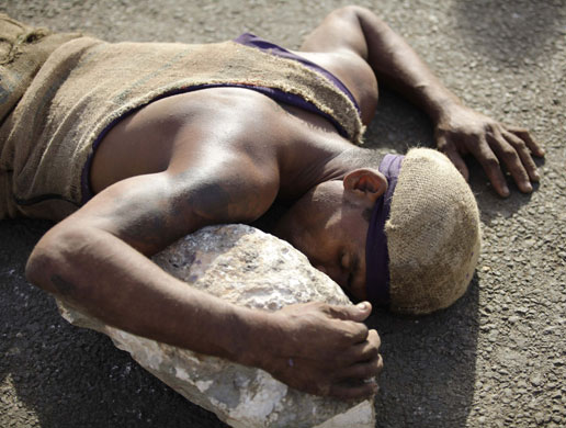 24 hours: A Cuban worshipper at Saint Lazarus in the town of Rincon 