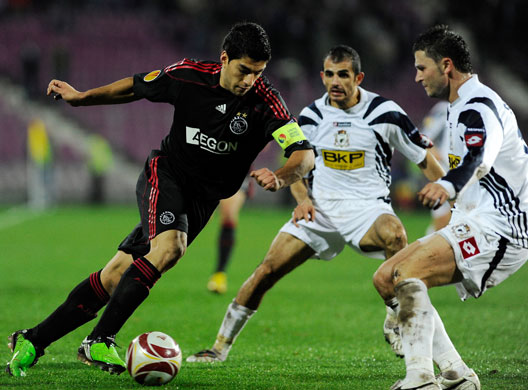 Transfer targets: Luis Suarez of AFC Ajax (L) vies with pl