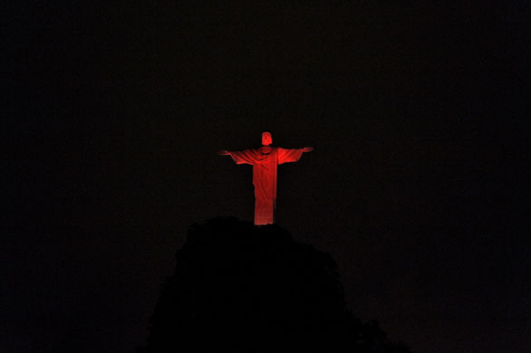 24 hours: Christ the Redeemer statue turned red for world AIDS day in Rio de Janeiro