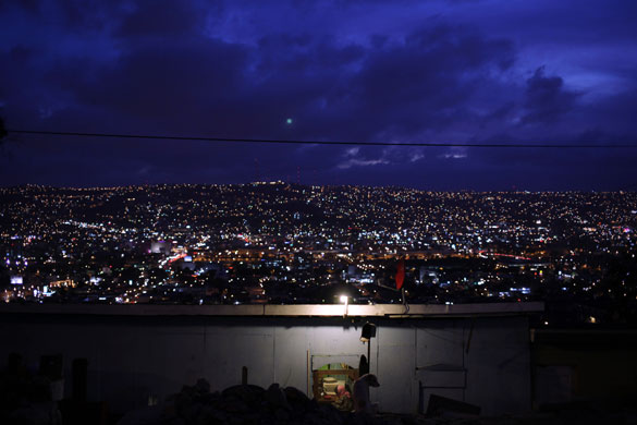 24 hours: A woman sits in her house in Tijuana, Mexico 