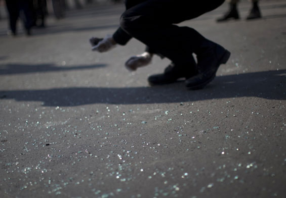 24 hours: Shattered glass lies on the pavement after suicide bomb attack in Islamabad