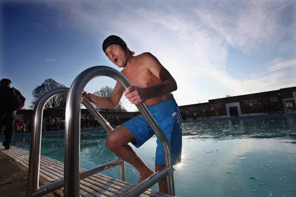 Snow around the world: London, UK:  A man reacts at the Winter Swim at Brockwell Lido