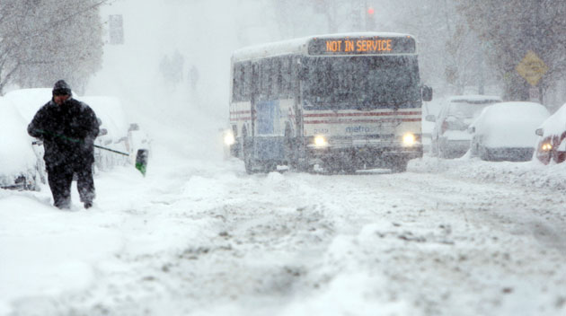 Snow around the world: Washington DC, US: A Washington Metrobus navigates the hill on 13th Street