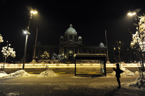 24 hours in pictures: Belgrade, Serbia: A woman waits for a night bus 