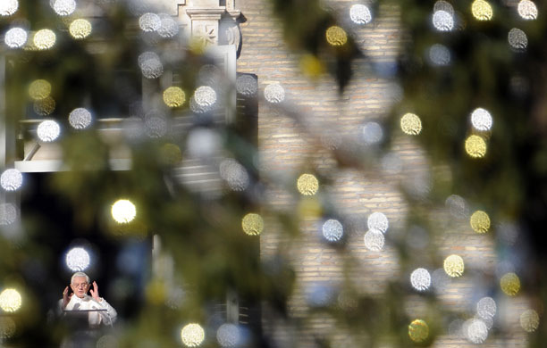 24 hours in pictures: The Vatican: Pope Benedict XVI blesses the faithful 