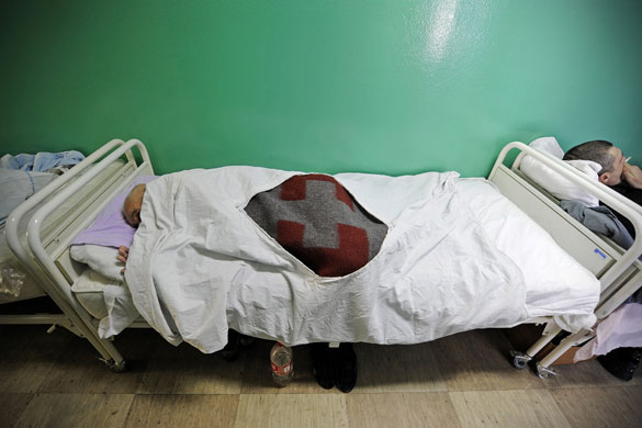 24 hours in pictures: Belgrade, Serbia: Homeless people rest in beds