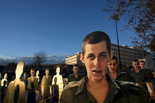 24 hours in pictures: Jerusalem, Israel: Cardboard cut-outs of Israeli soldier Gilad Shalit